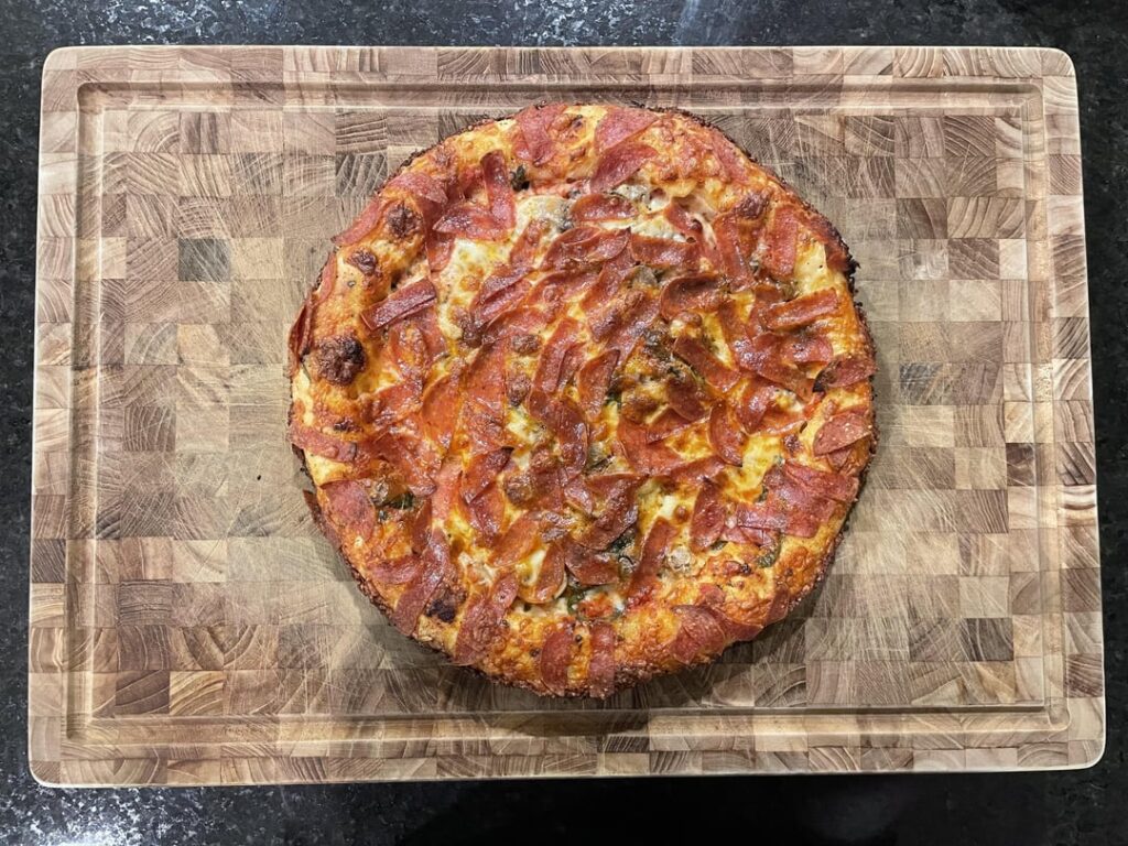 Cast iron style pepperoni and mushroom stuffed crust pizza