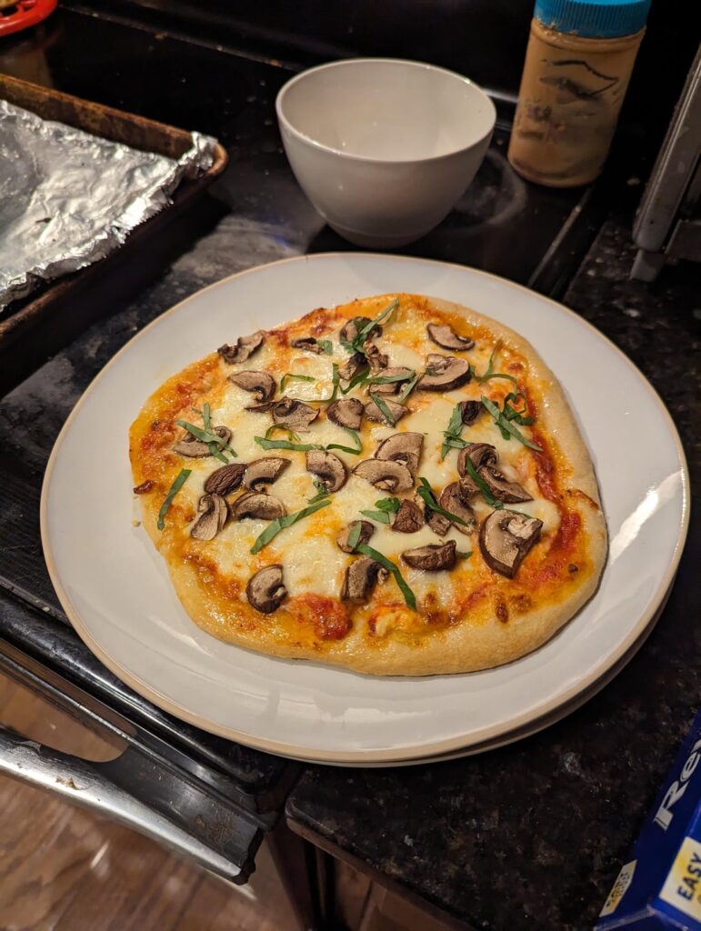 Less than 600 calories for the whole thing! 10 inch pizza with garlic butter crust and 44 grams of protein!