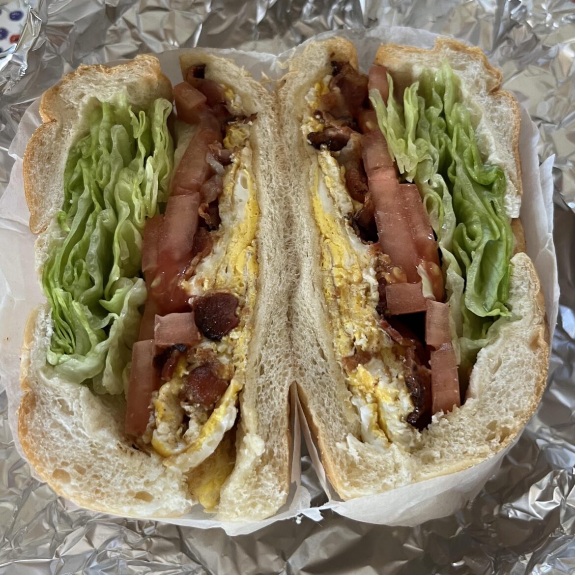 Get this - lettuce and tomato on my bacon and egg on a roll! What a crazy day.