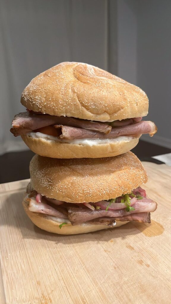 Roast beef sandwiches with pickled onions, cilantro, tomato & lemon horseradish sauce