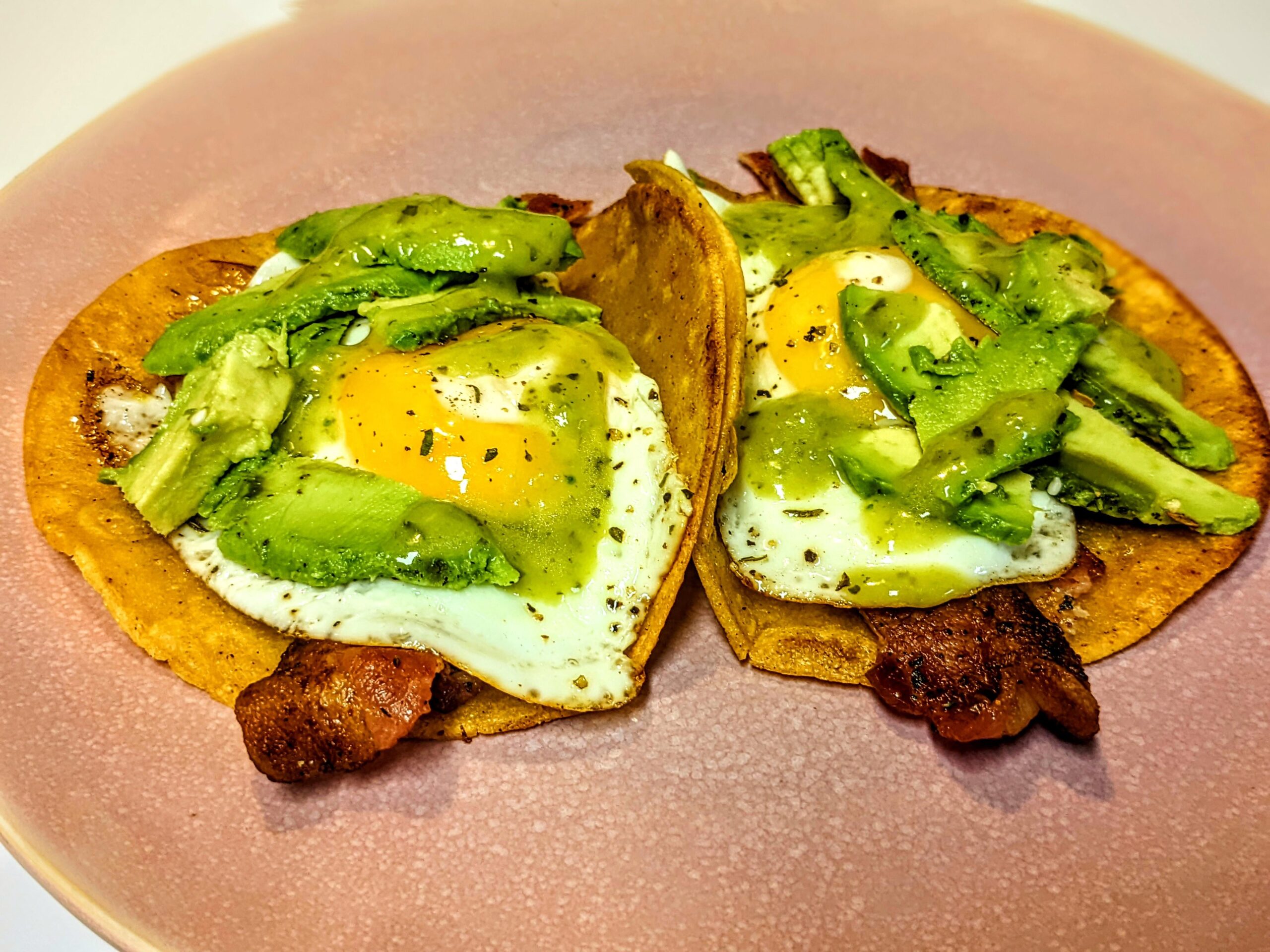 Homemade breakfast tacos never miss. Topped with some Herdez avocado