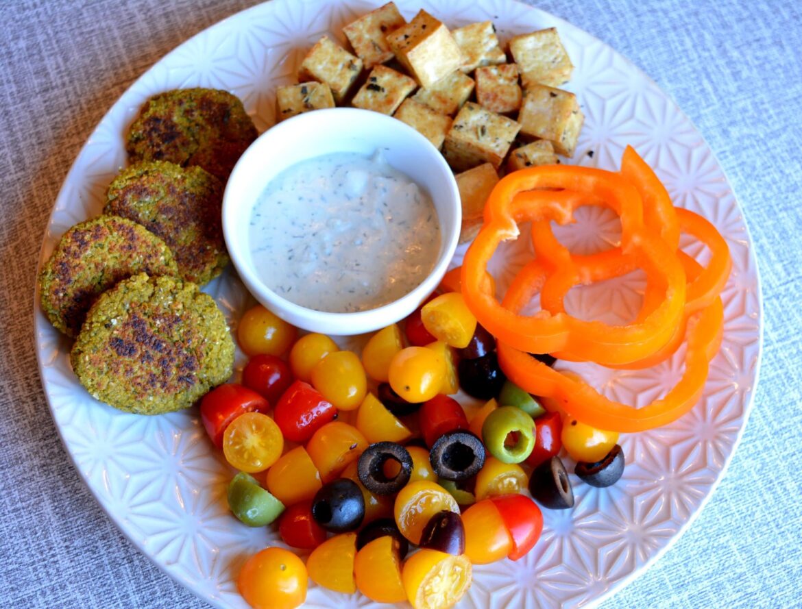 387 cal snacky lunch - falafel, tzatziki sauce, tofu, tomatoes, bell pepper slices