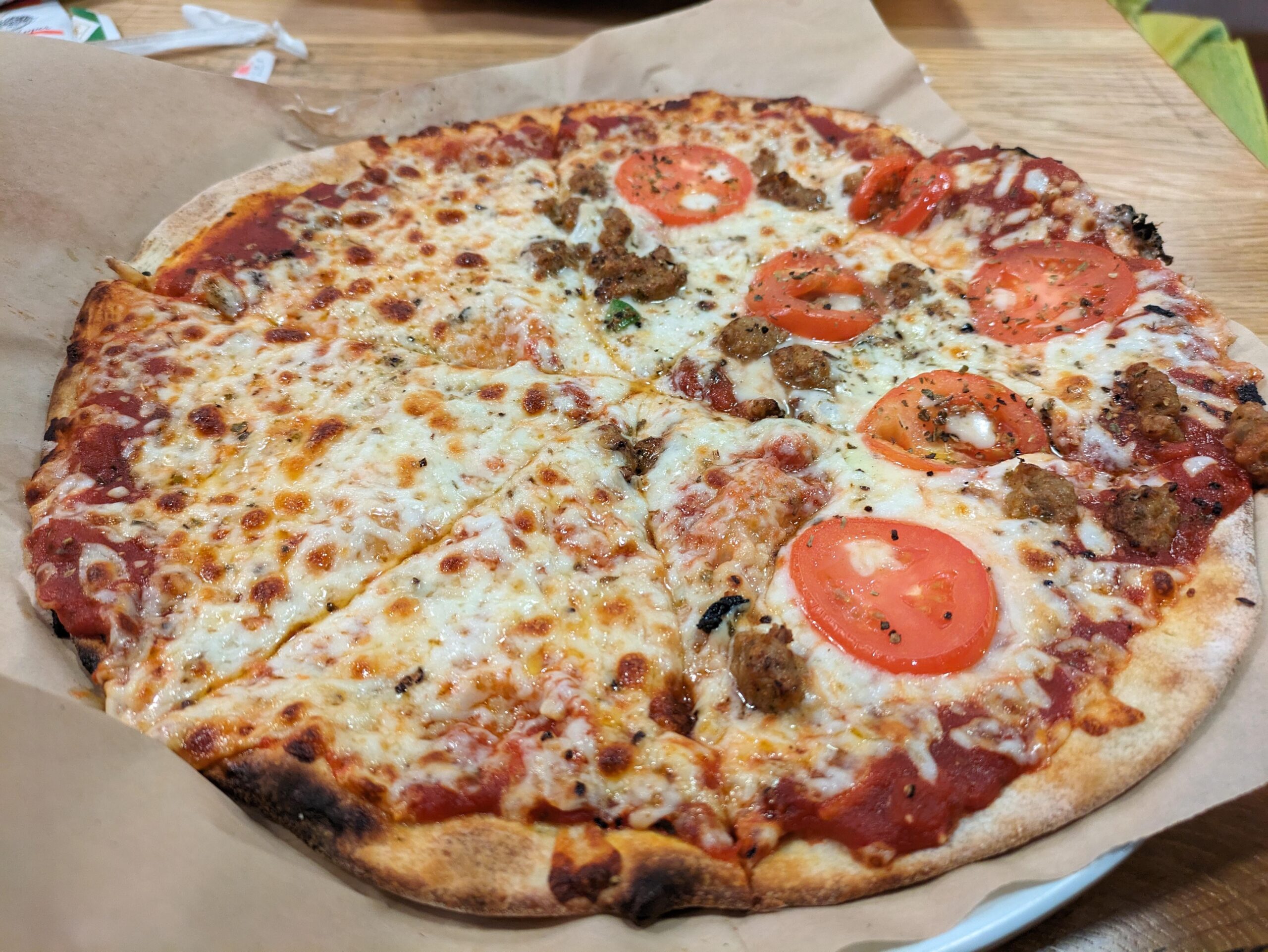 Half cheese, half spicy sausage and sliced tomato. This was excellent