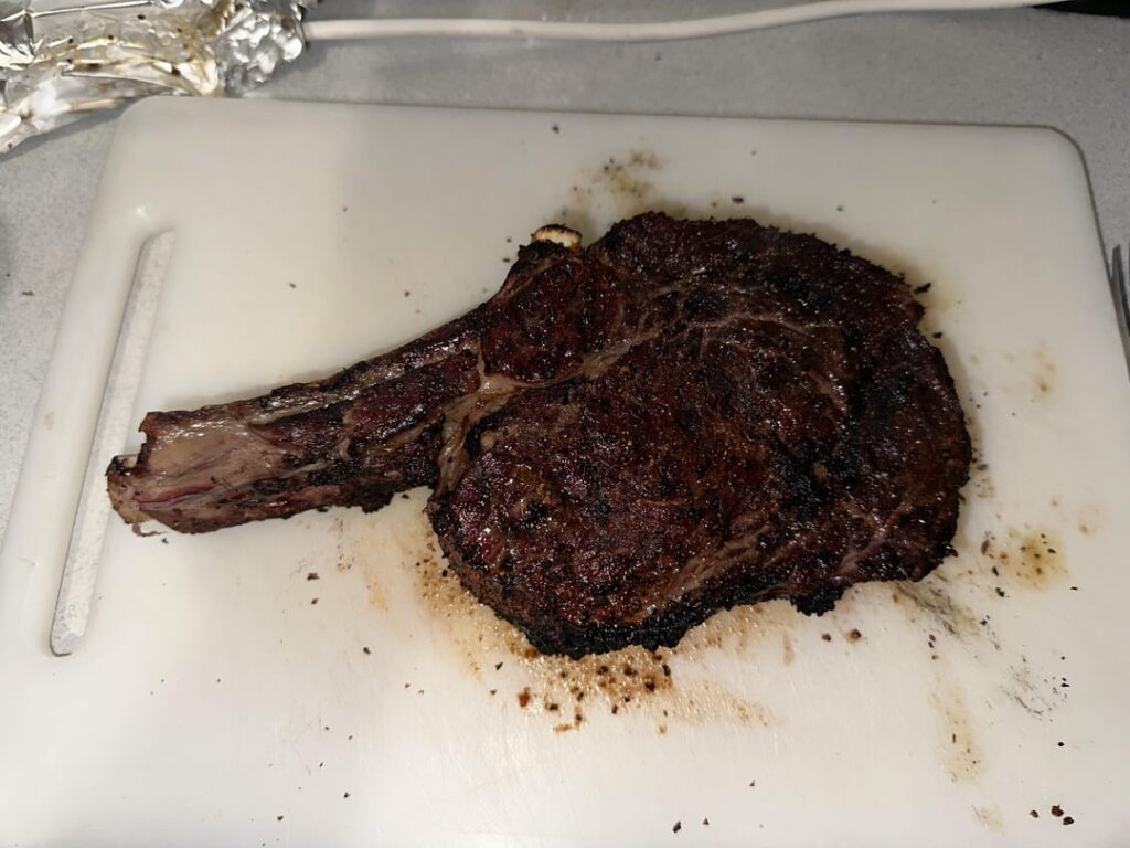 Caveman seared ribeye over charcoal