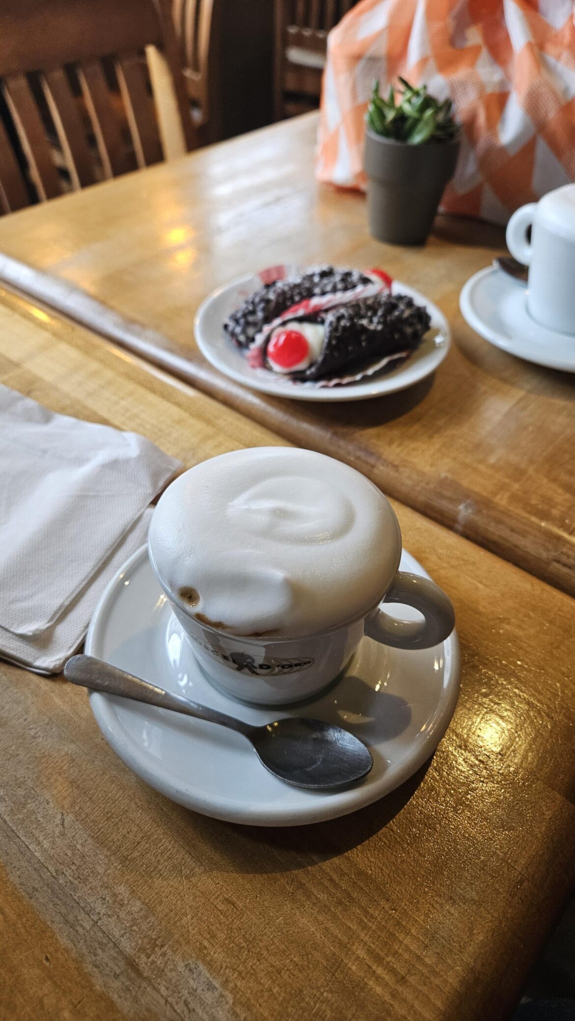 Cannoli and cappuccino