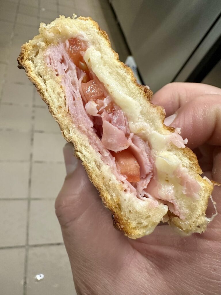 Ham and Swiss with mayo, tomatoes, salt, pepper, oil and vinegar. Toasted.
