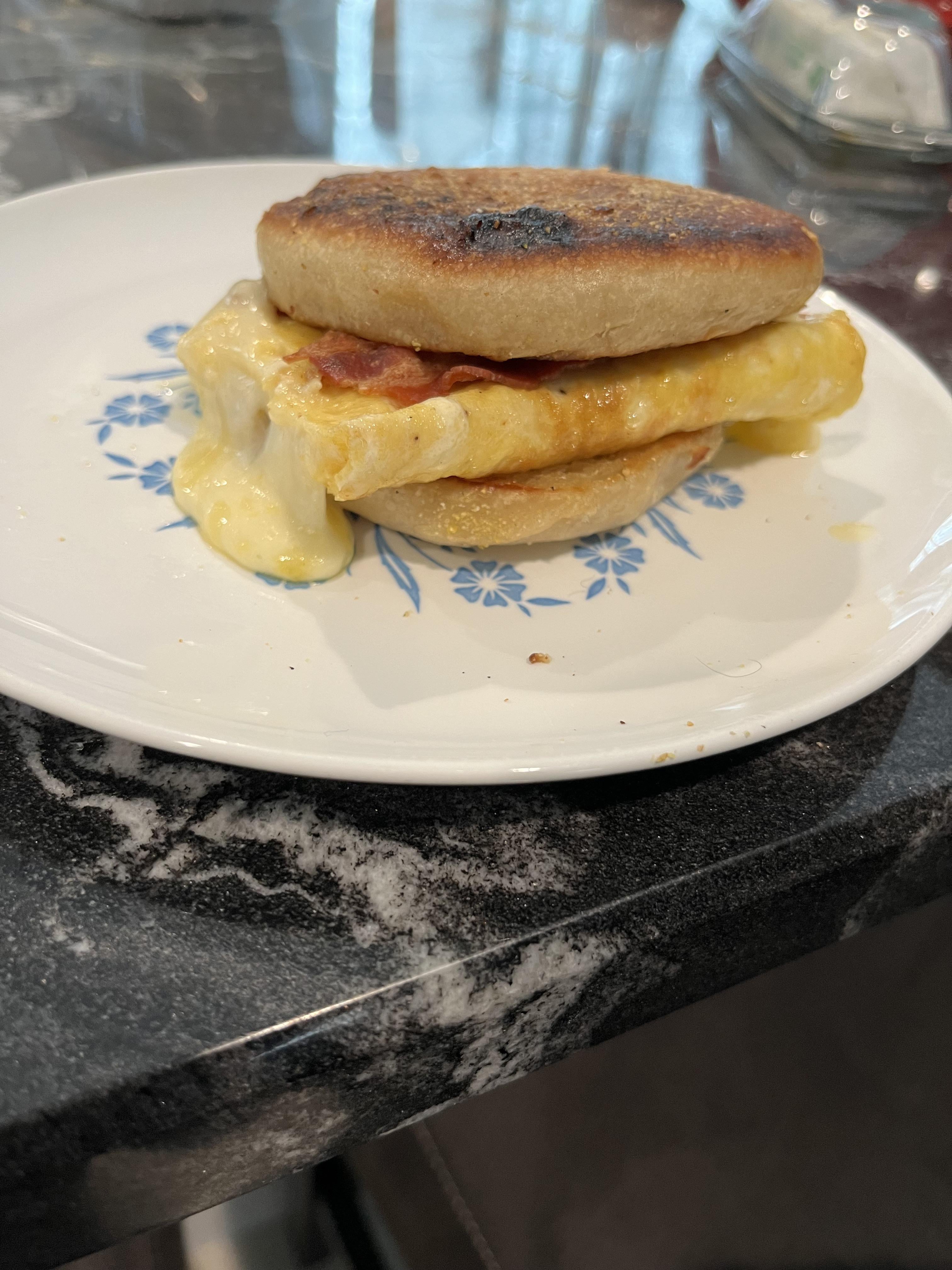 Bacon, egg, and cheese on homemade English muffin. 1/2 of a 3egg