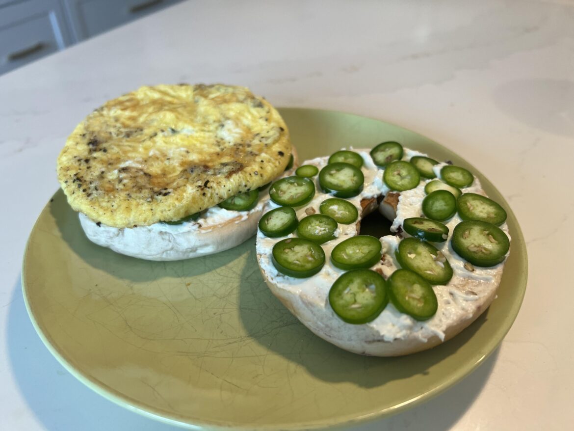 Blueberry bagel, sliced serranos, fried egg.