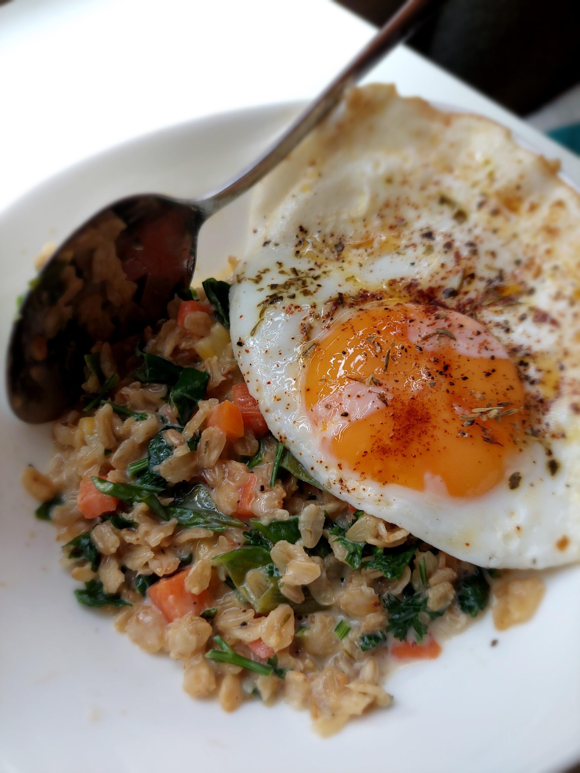 Cheesy savory oatmeal with fried egg Dining and Cooking