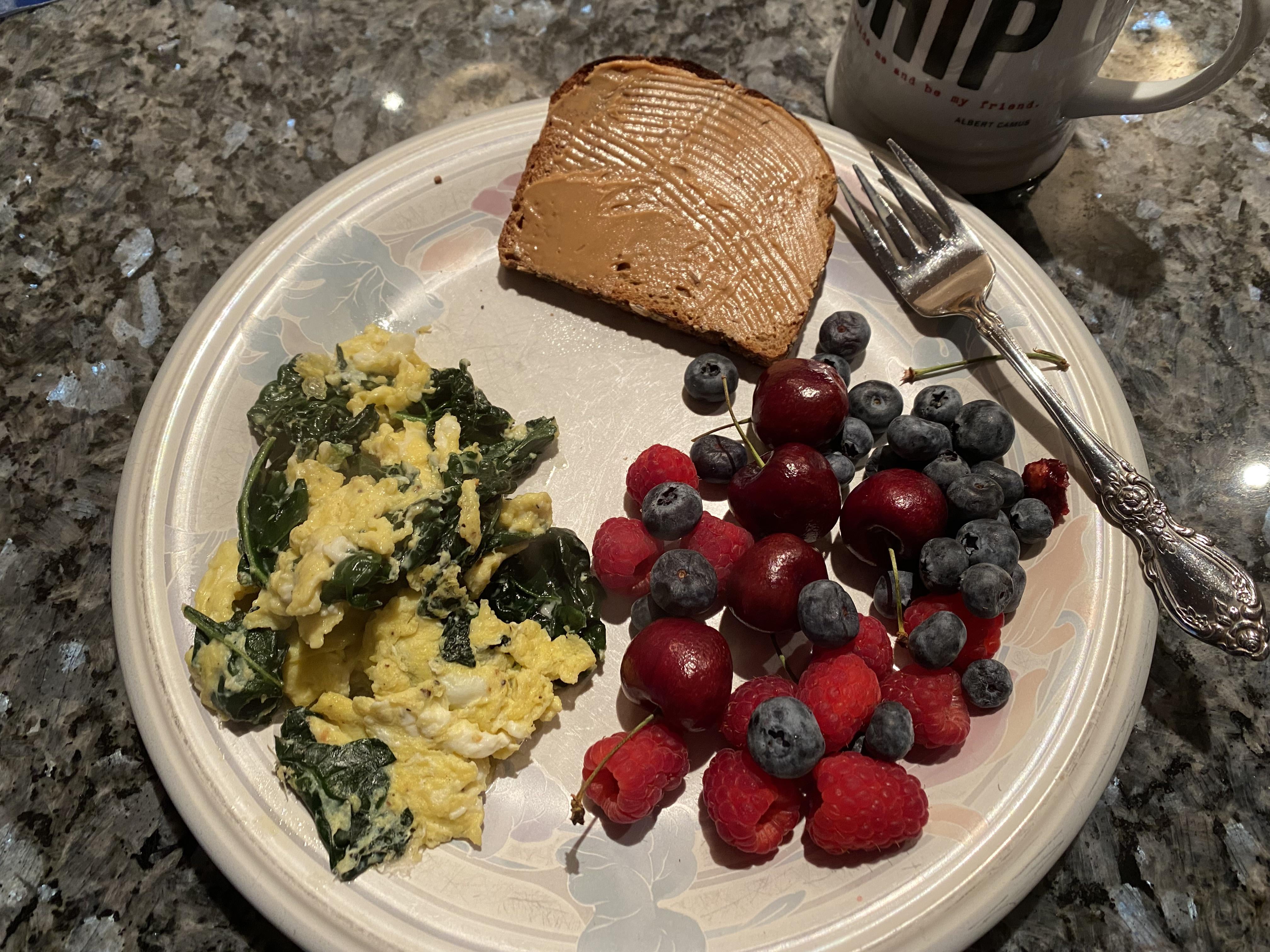 Kale & egg scramble, PB toast, mixed berries, and Earl gray tea