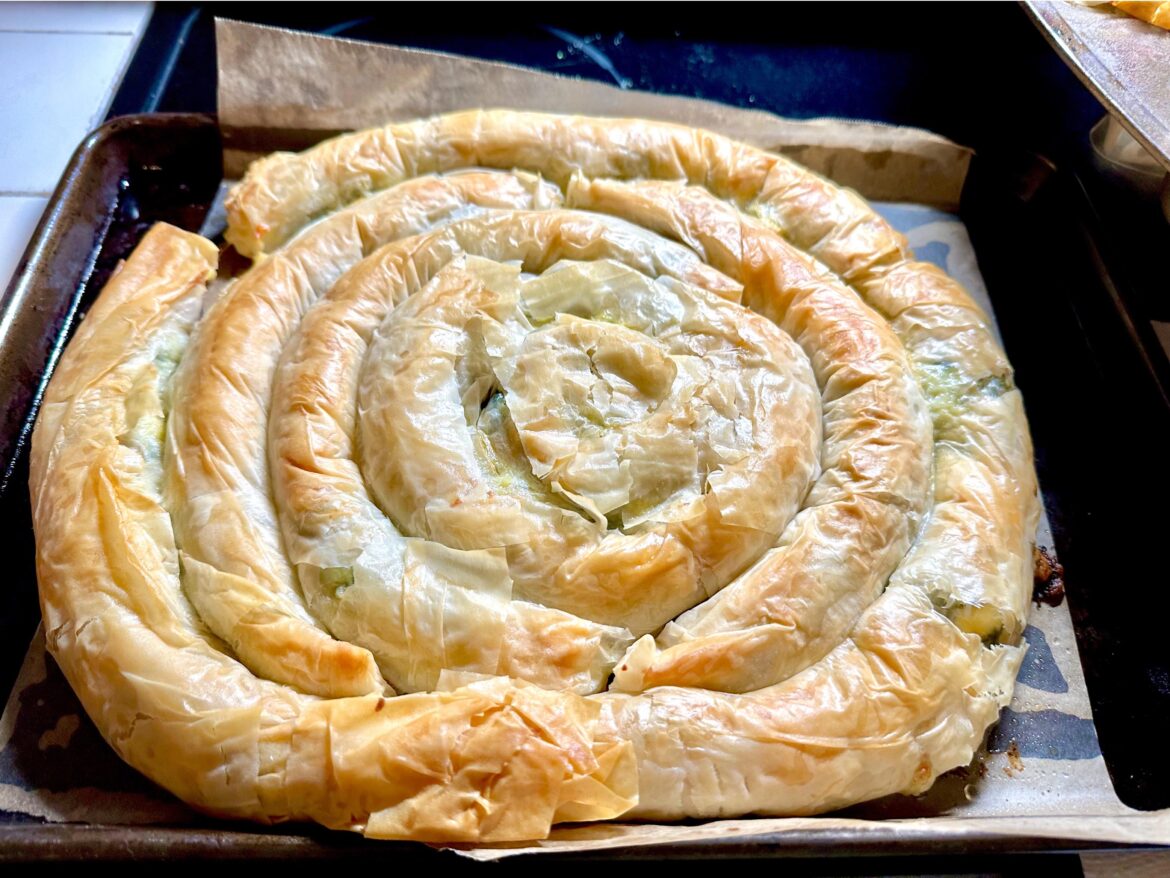 My 11-yr old saw puff pastry at the store and said… can we make spanakopita? I said we can certainly try! It might not be purty, but the fresh spinach, garlic, and dill made it sooo tasty!