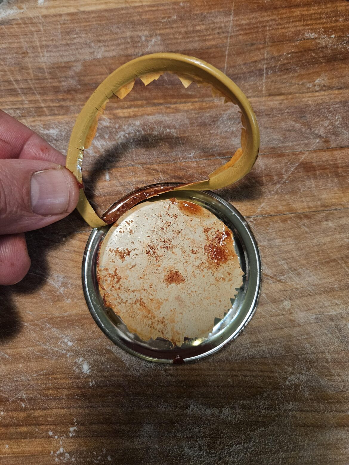 This is a new one on me. Seal peeled off the lid on opening.