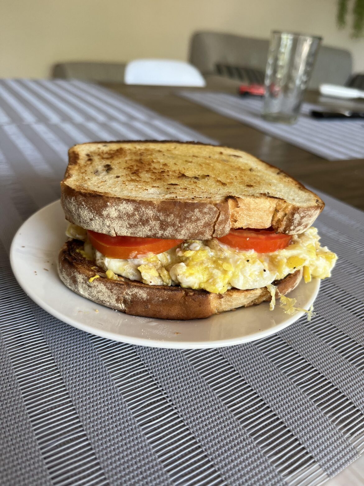 Cheese egg and tomatoes. Butter toasted the bread. Mustard. Jujuy, Argentina.