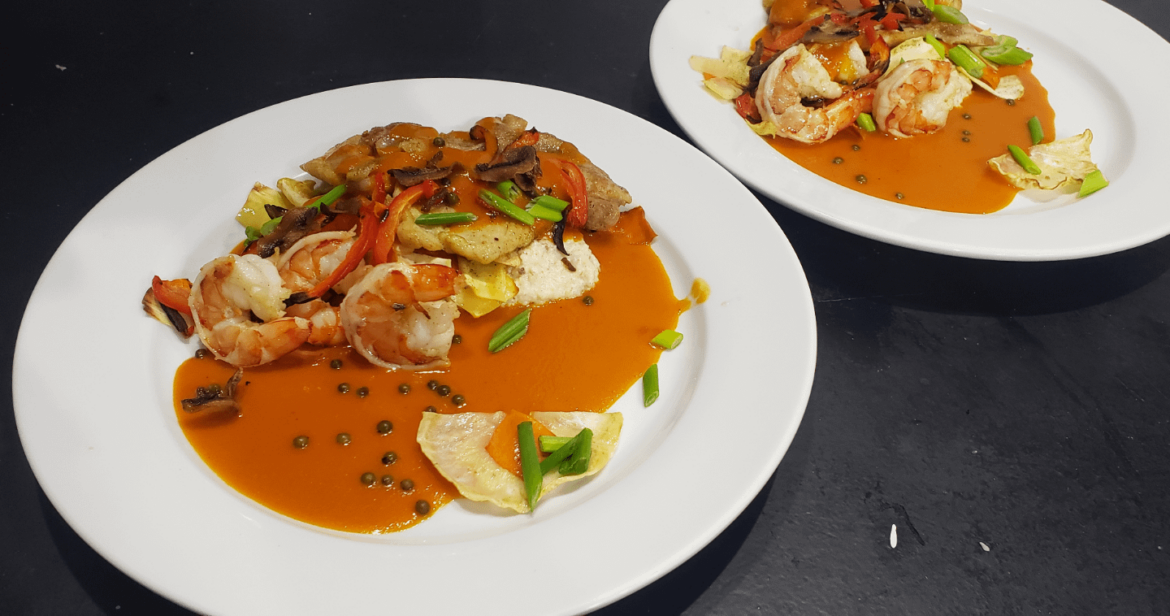 Chicken and shrimp over polenta covered in a tomato sherry reduction with root vegtables.