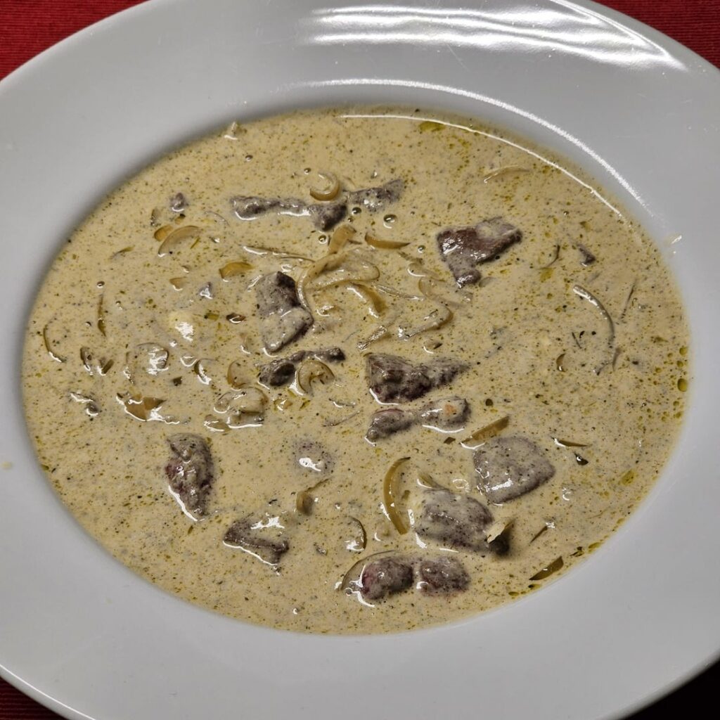Sliced veal liver in an onion and mascarpone sauce with plenty of white wine (inspired by Fegato alla Veneziana, but totally different), served with freshly baked bread