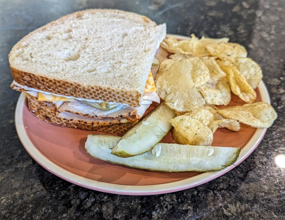 Pepper turkey, Colby jack, stone ground mustard, mayo, and Grillo's pickle on sourdough