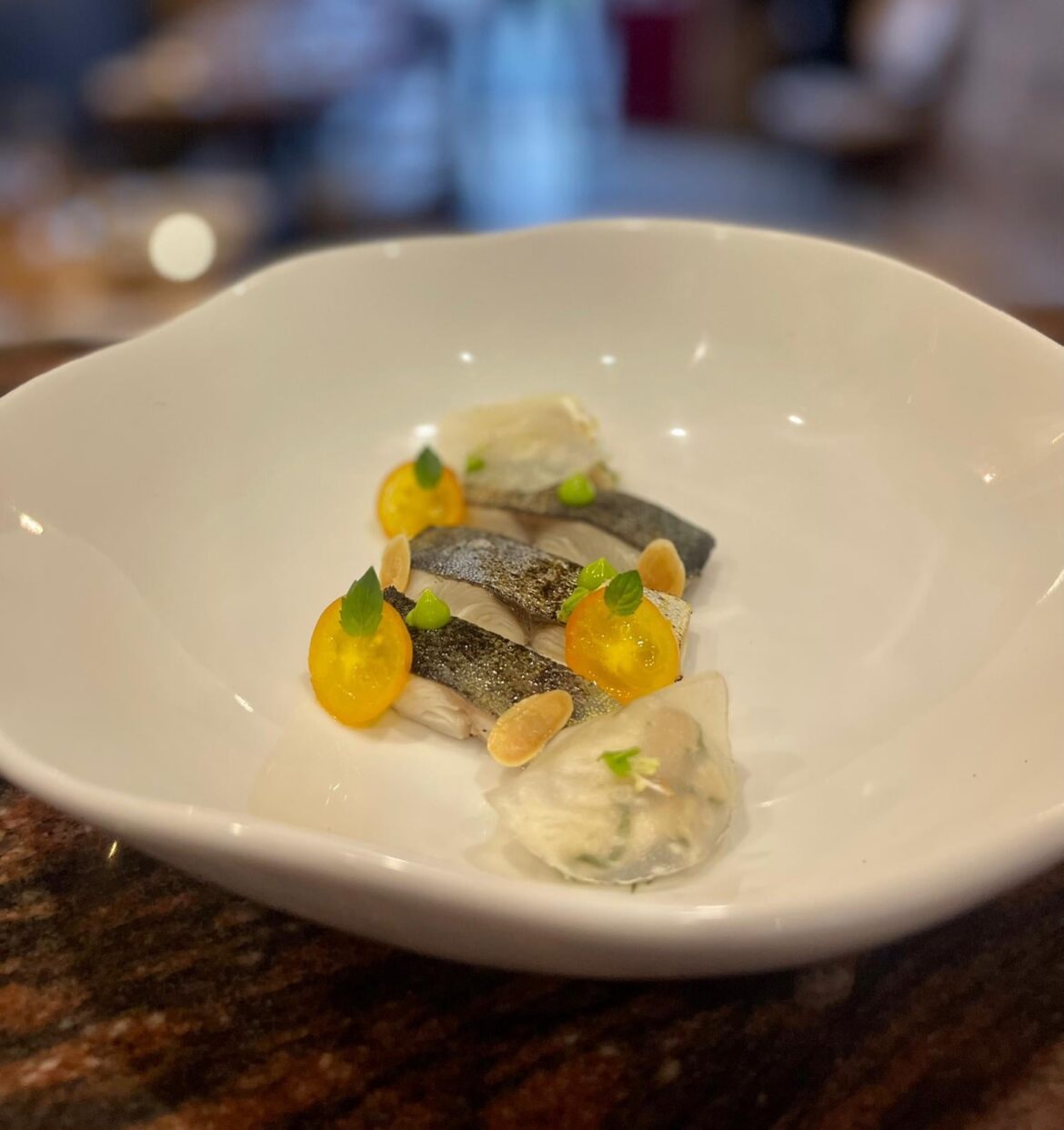 Dolphin fish served two ways. Pickled&Smoked and Tartar. Pickled celeriac, Pine emulsion, cherry tomatoes, and a sauce made from celeriac pickle, unripe loquat juice, and pine oil