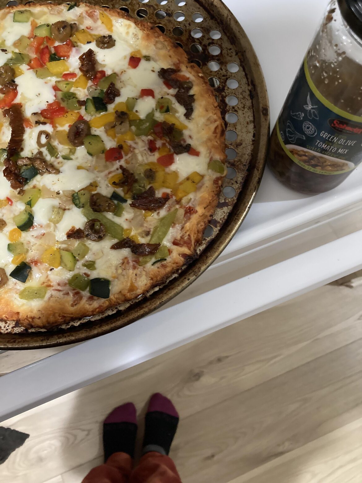 Costco veggie cauliflower crust pizza with olives & tomato = dinner