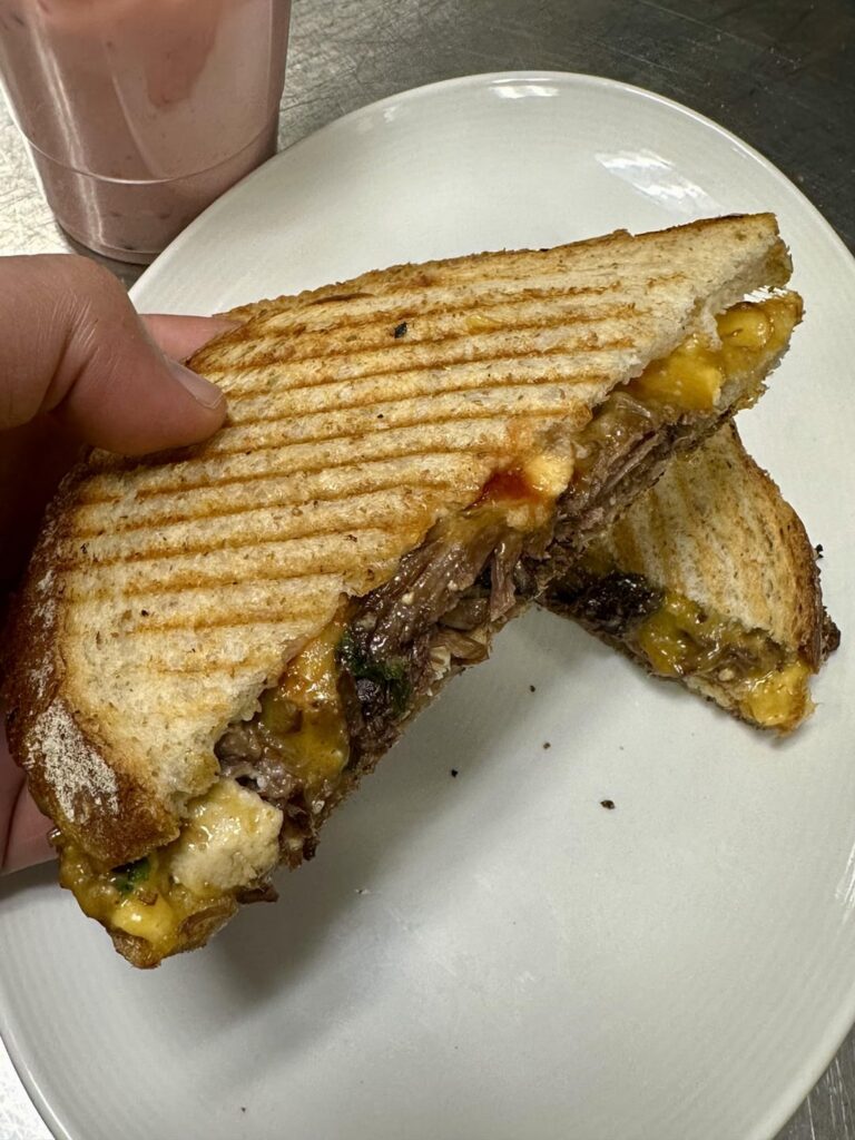 Shortrib with cheddar, eggs, scallions, mayo and ketchup.