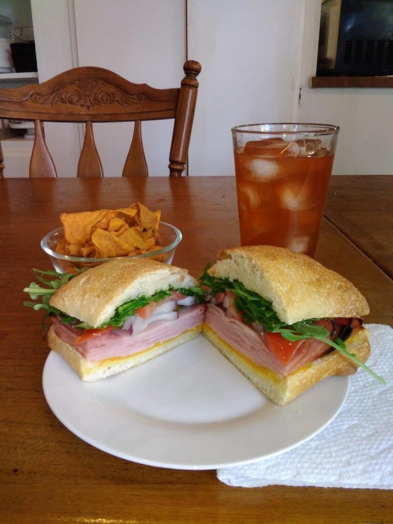 Ham and cheddar with plenty of fixins...