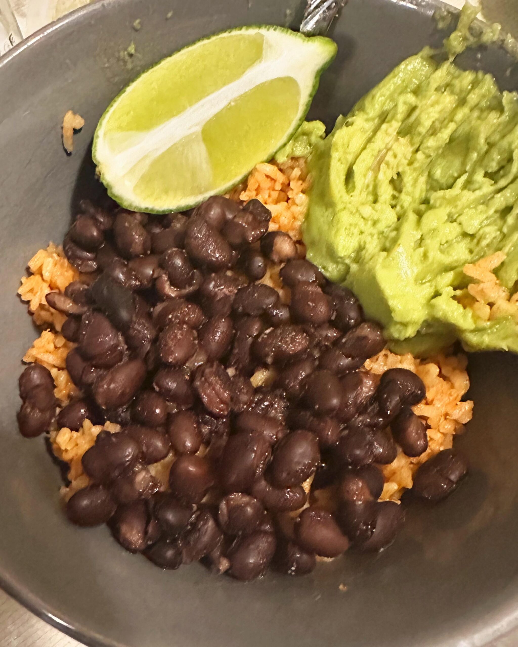 Mexican rice and black beans, added prepackaged guac and rotisserie
