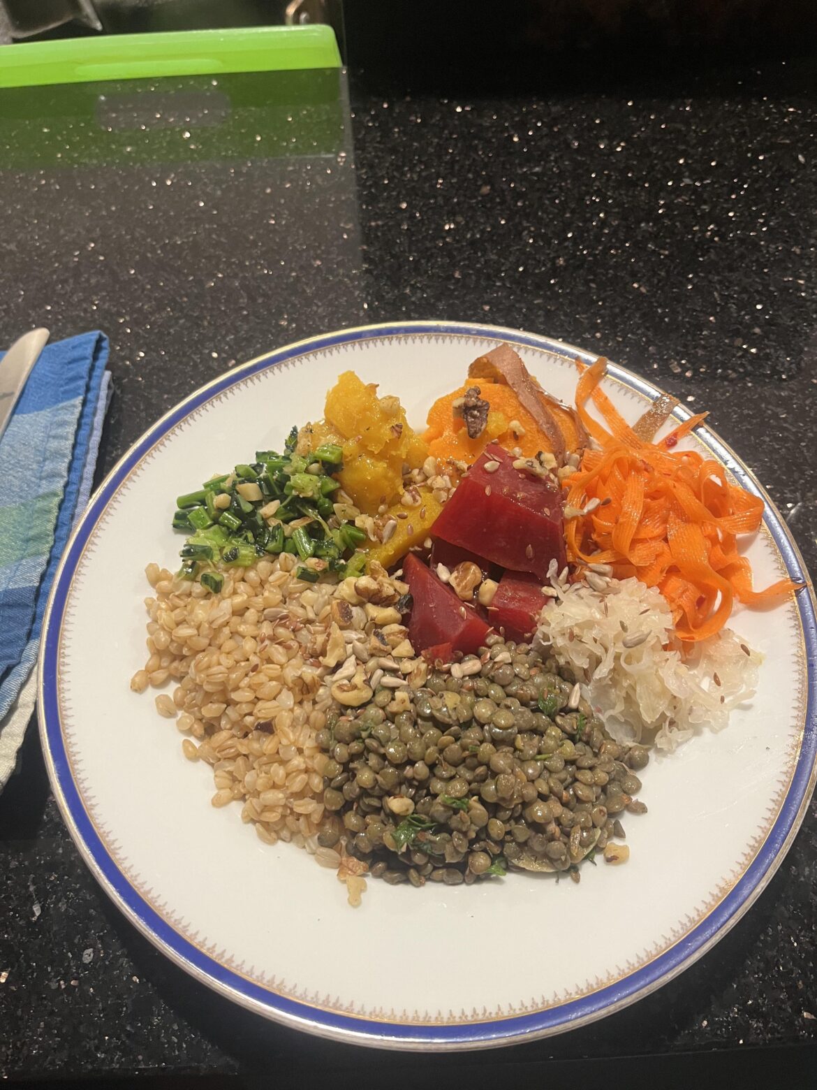 Loaded Grain Bowl with Barley, Spiced Lentil Salad, Saurkraut, Pickled Wasabi Carrots, Steamed Beets, Roasted Squash and Sautéed Kale Stems. Topped with some seeds and nuts 😋