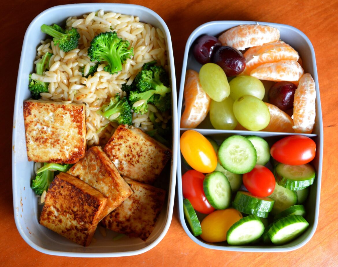 377 calories packed lunch. Japanese BBQ tofu, miso ginger riced pasta with broccoli, fruit and veggies