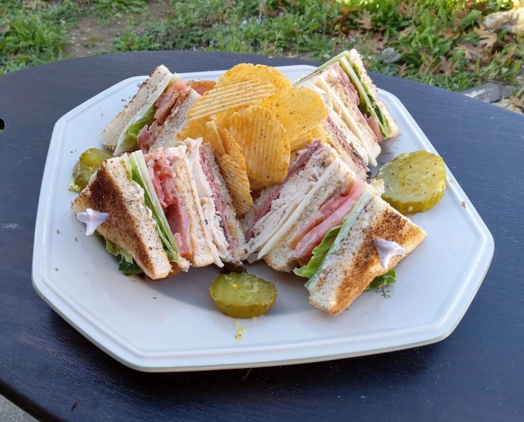 The Morning Club: Pastrami, home made chicken loaf, dry cured bacon, jack cheese, and LTM on toasted cheap white with home made sweet horseradish pickles and chips. Plastic golf tees in lieu of toothpicks (buy the tees, get free rum! I don't golf but I rum ;-)