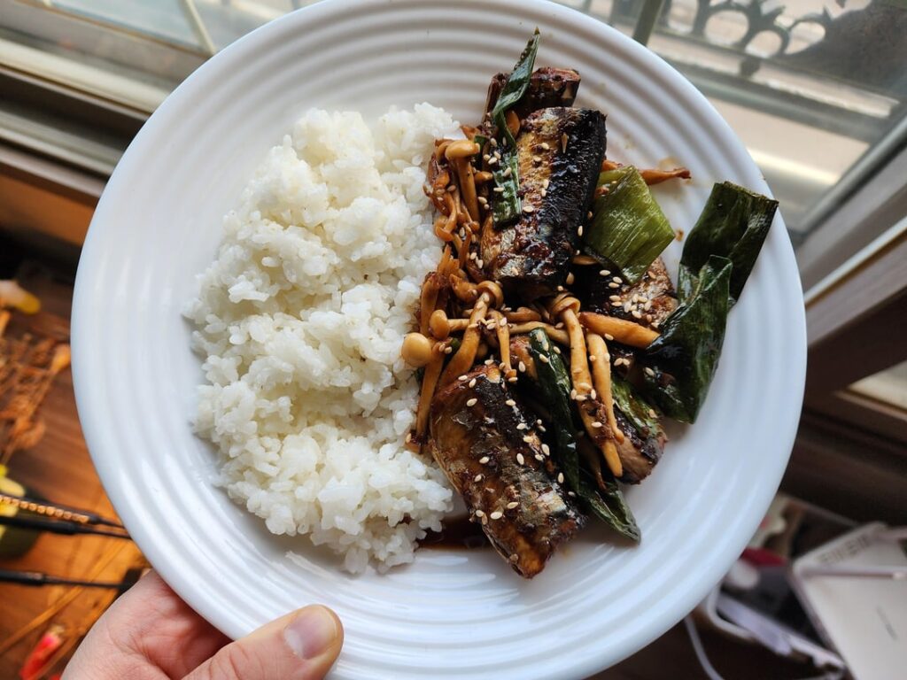 Korean Canned Pacific Saury soy sauce braised with mushrooms and green onions and served with rice!