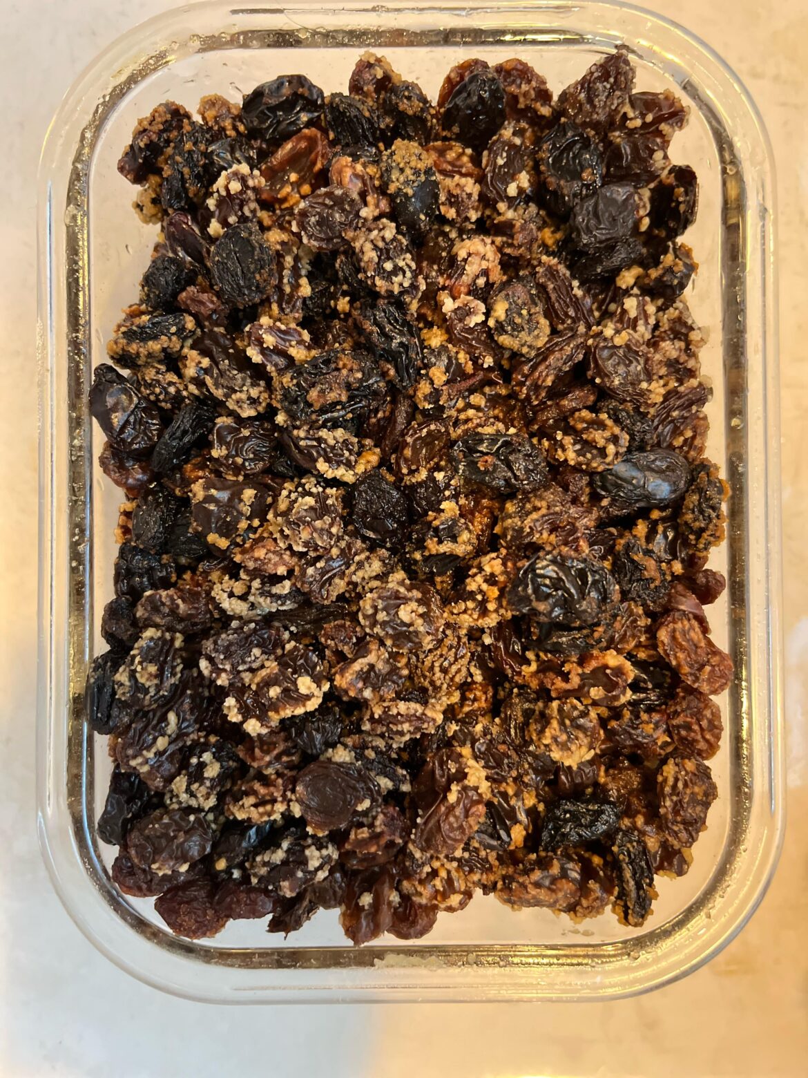 6 mo Rum Soaked Raisins in airtight container have white stuff on them. Is it Mold? Yeast? Sugar? … safe?