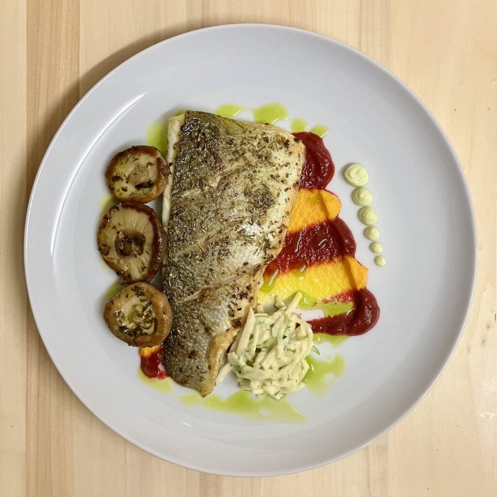 Pan-Seared Sea Bass with Beetroot and Carrot Purée, Sautéed Wild Mushrooms, Celeriac Slaw and Creamy Horseradish