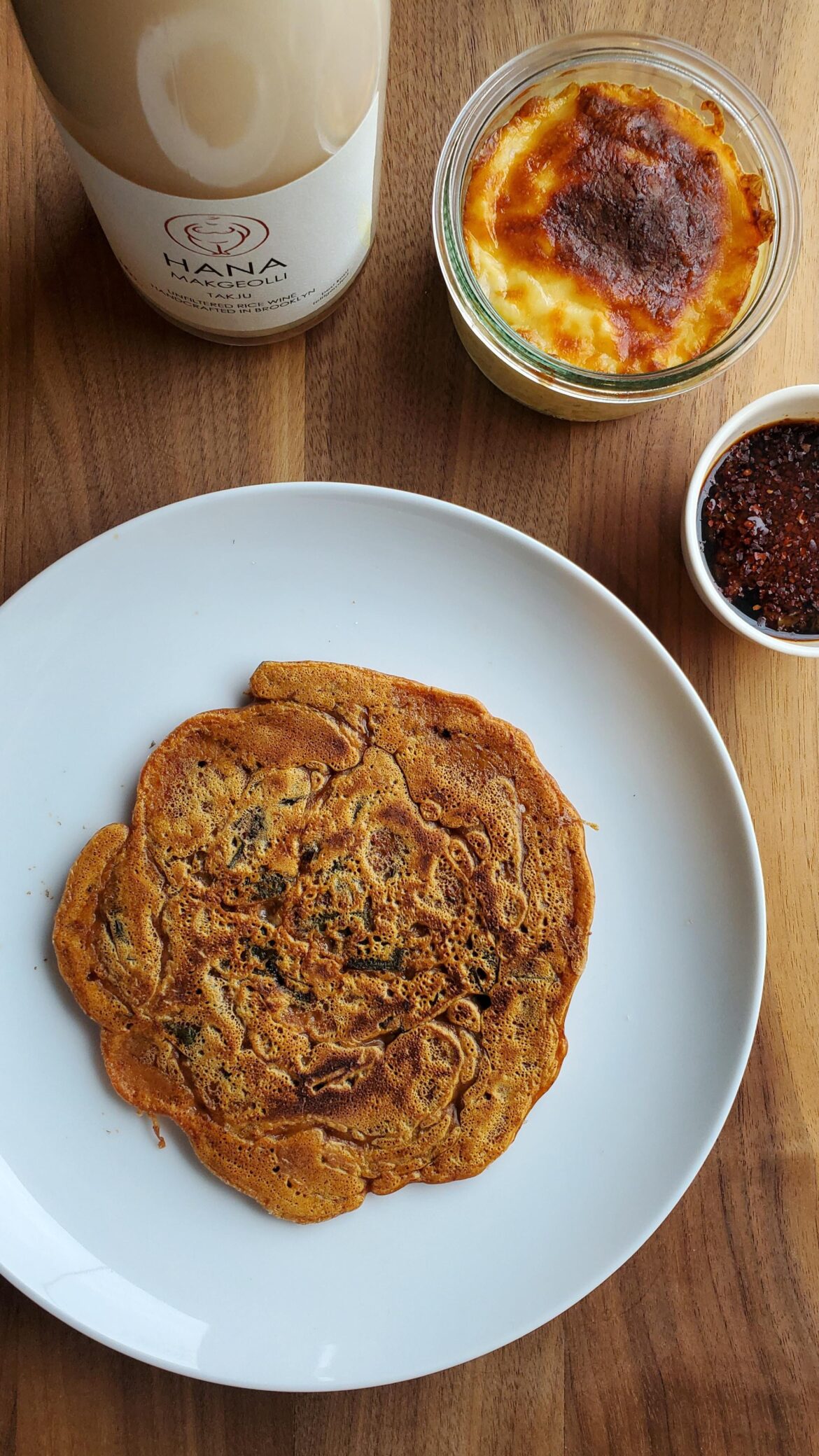 I wish this looked prettier, but I made jeon for a rainy day! Kimchi jeon using homemade buchu kimchi, corn cheese, and a locally-made makgeolli!