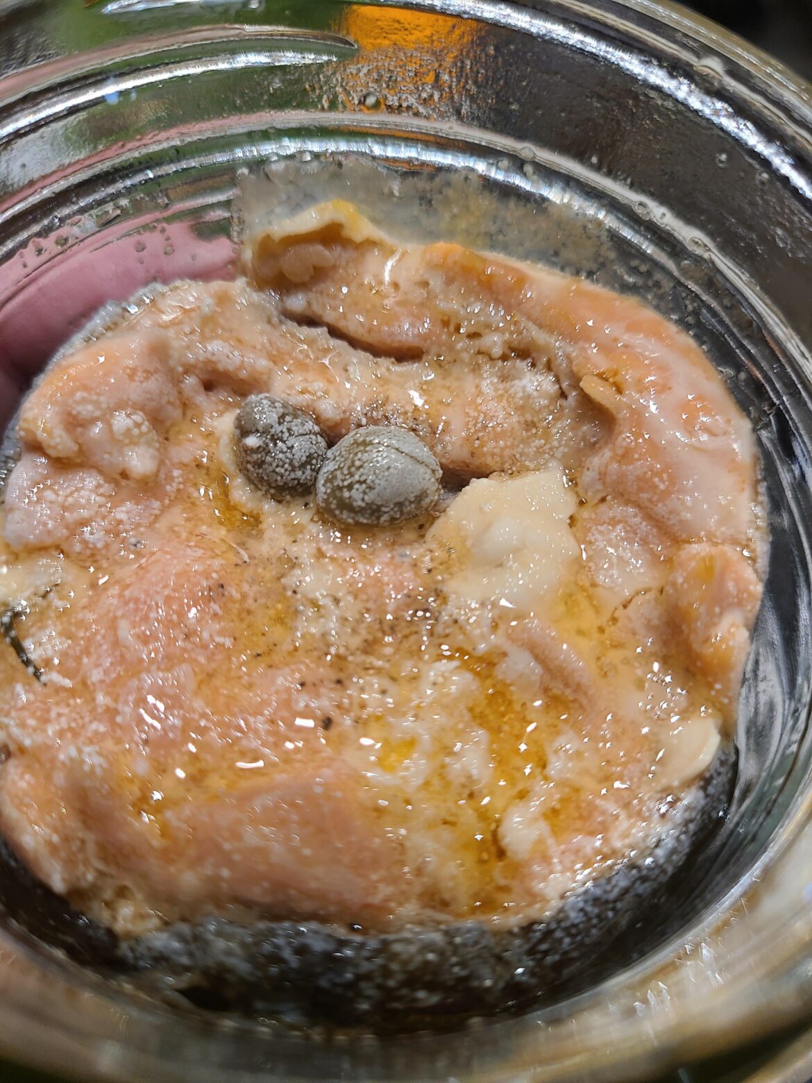 What are these white specs on my canned salmon?