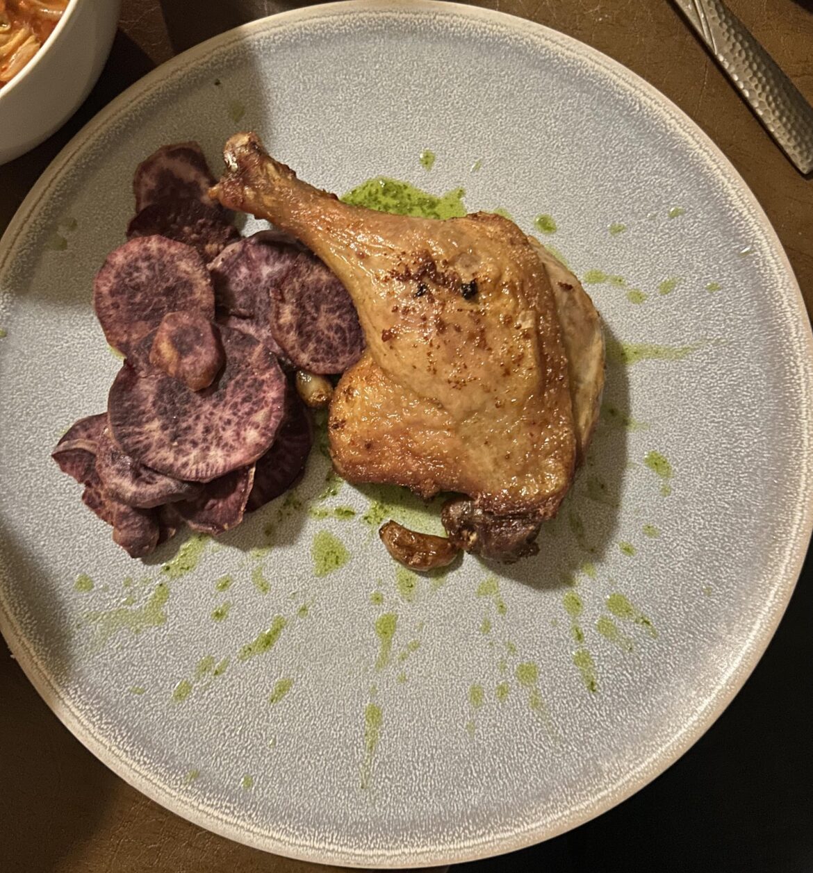 Duck confit, purple yam, watercress vinaigrette