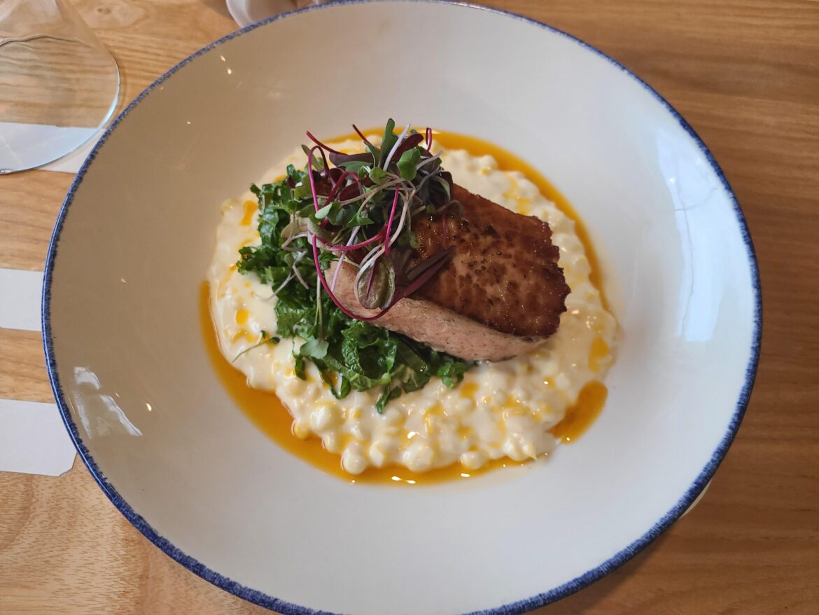 Bacon fat sous vide pork loin | Creamed corn | wilted mustard green | birds eye chili oil