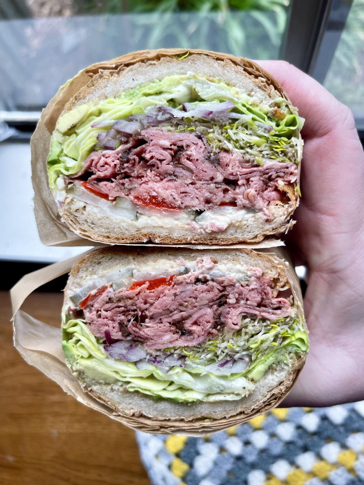 [homemade] Roast beef, aged English white cheddar, avocado, butter lettuce, sprouts, red onion, mama lil’s hot peppers, pickles, horseradish dijonnaise, seeded hoagie roll
