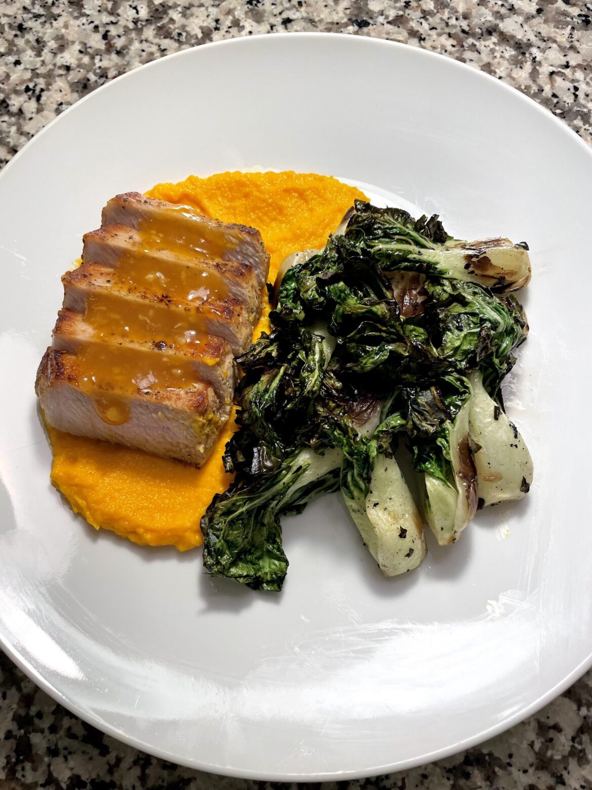 Pork chop, carrot puree, orange/Gochujang sauce, grilled bok choy