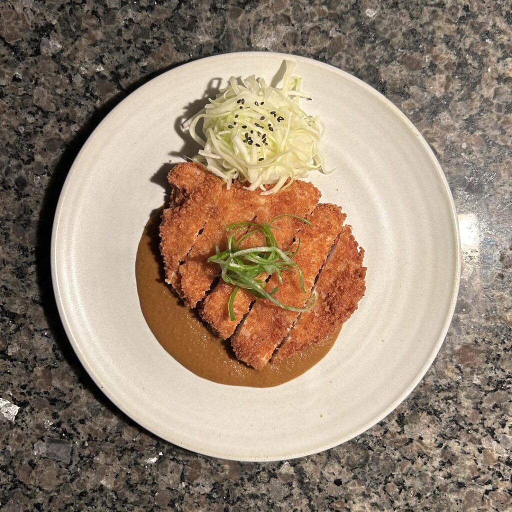 Tonkatsu Curry. Pork loin, Japanese curry, cabbage slaw