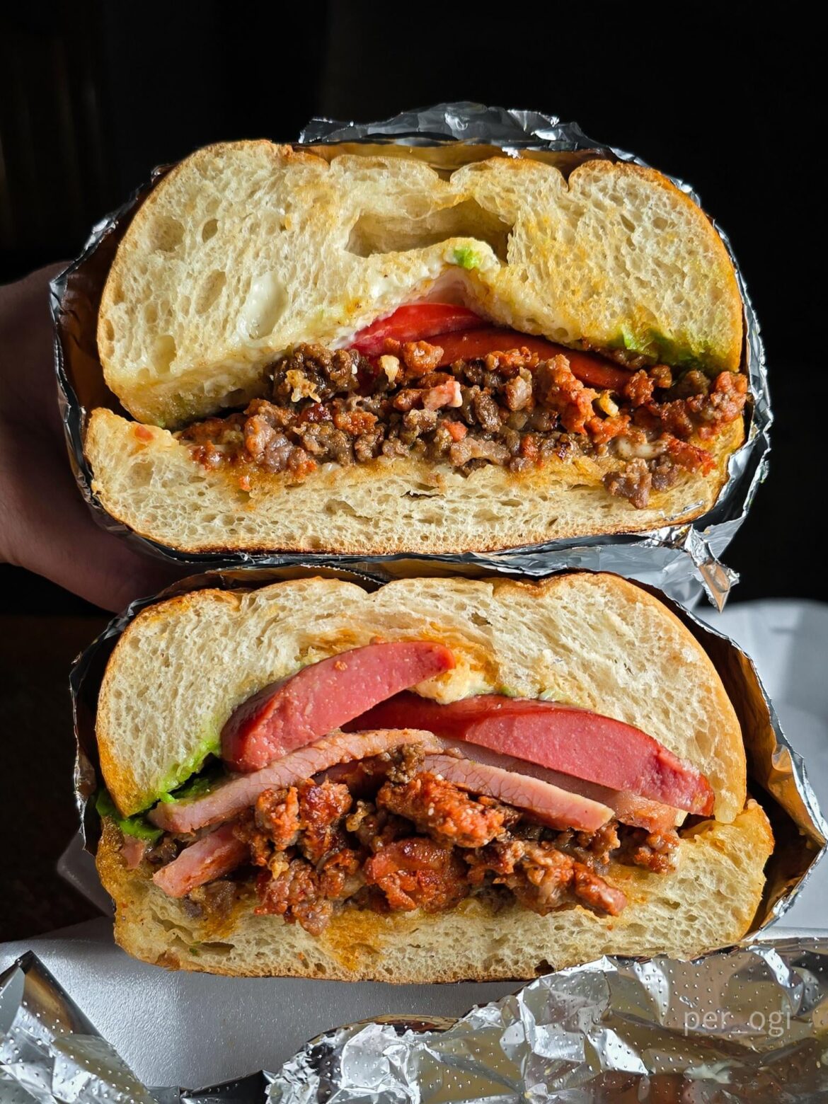 Torta Cubana w/ chicken, asada, sausage, chorizo, ham, jalapeño, avocado, mayo, and tomato