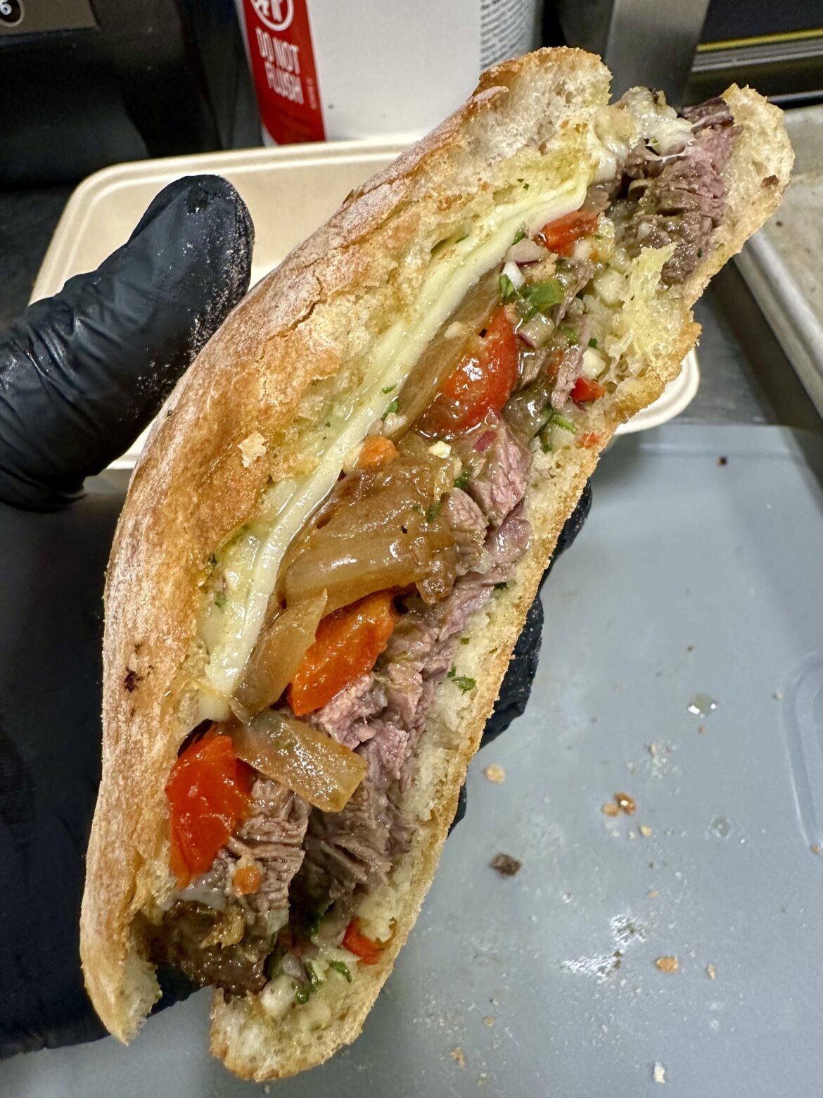 Skirt steak, chimichurri, Swiss, roasted peppers and caramelized onions