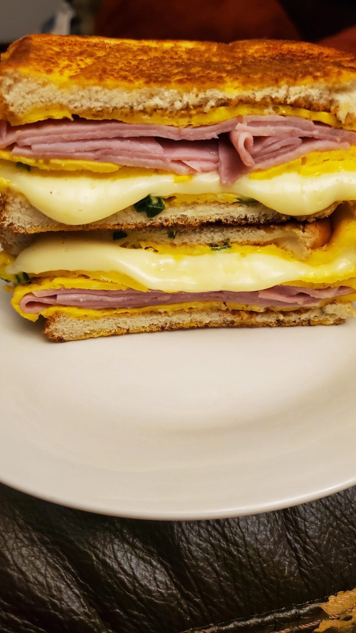 Egg toast sandwich with smoked ham and American cheese.