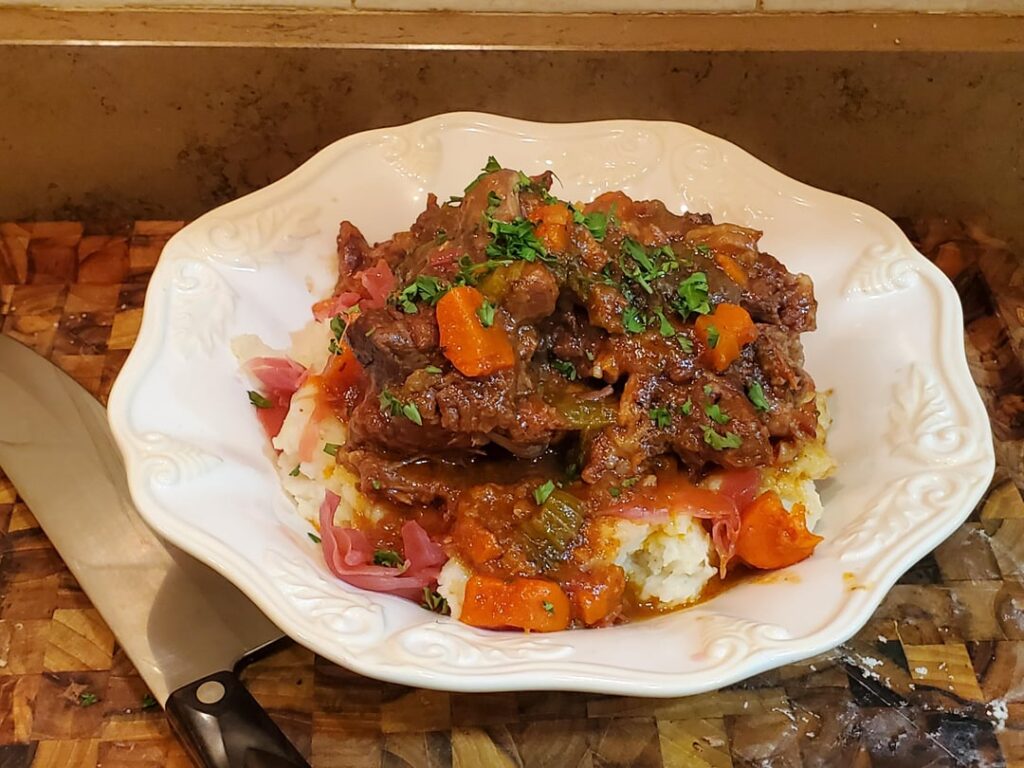 oxtail over potatoes and home fermented purple sauerkraut