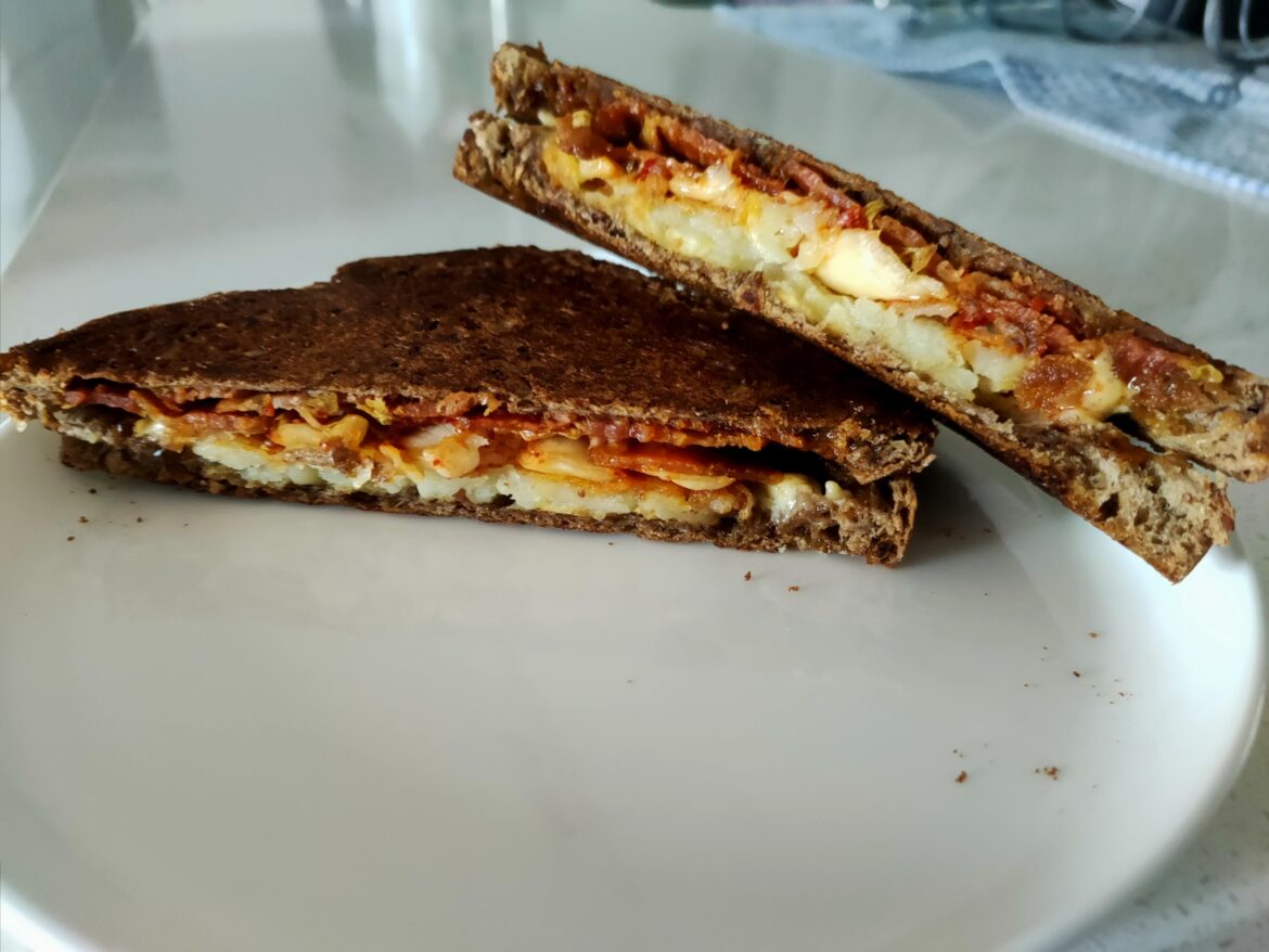 Bacon, hash brown, kimchi, truffle cheddar on roggenbrot