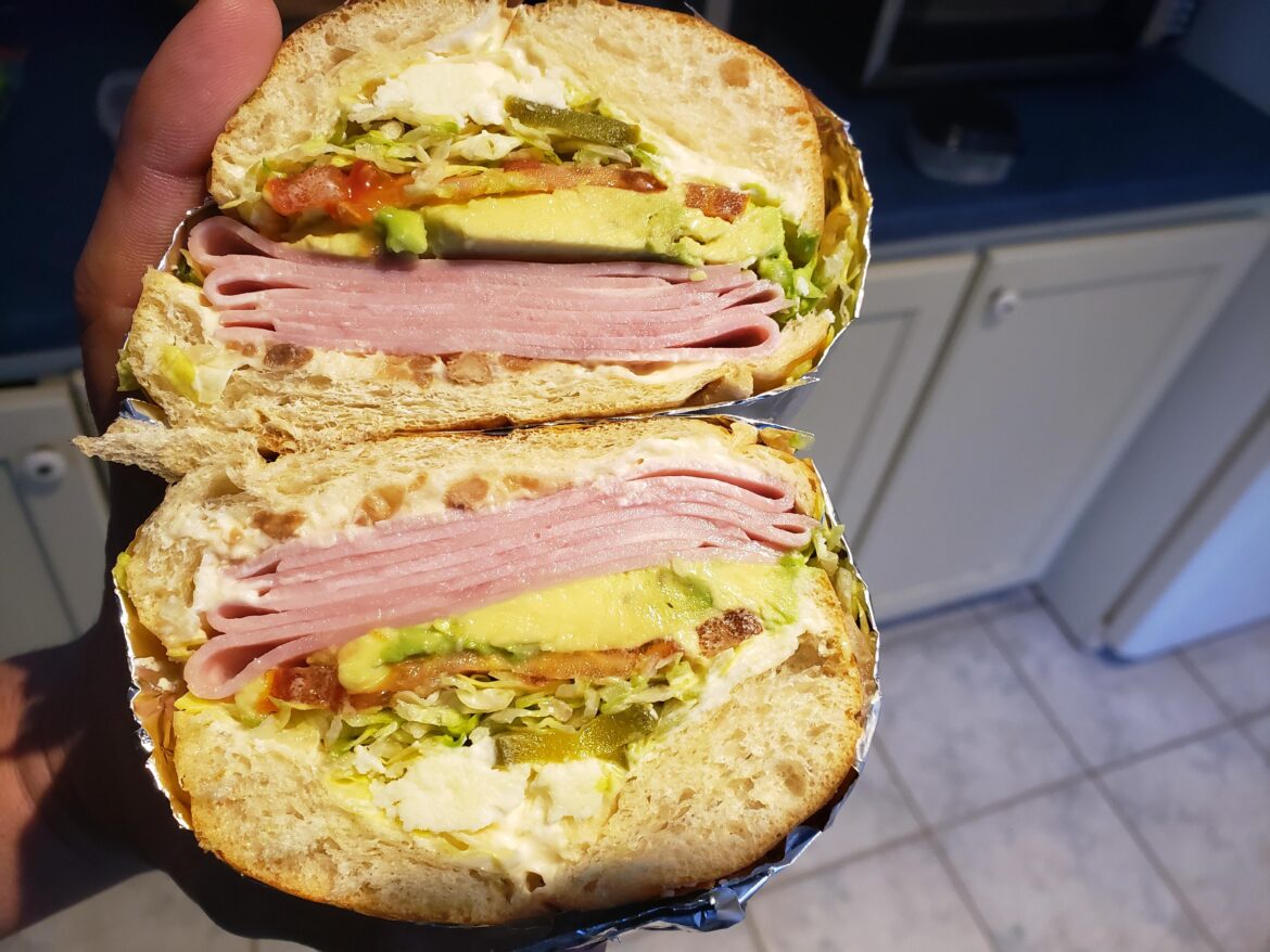 Ham, Avocado, tomato, lettuce, pickled jalapeño, refried bean and queso fresco. On a Bolillo.