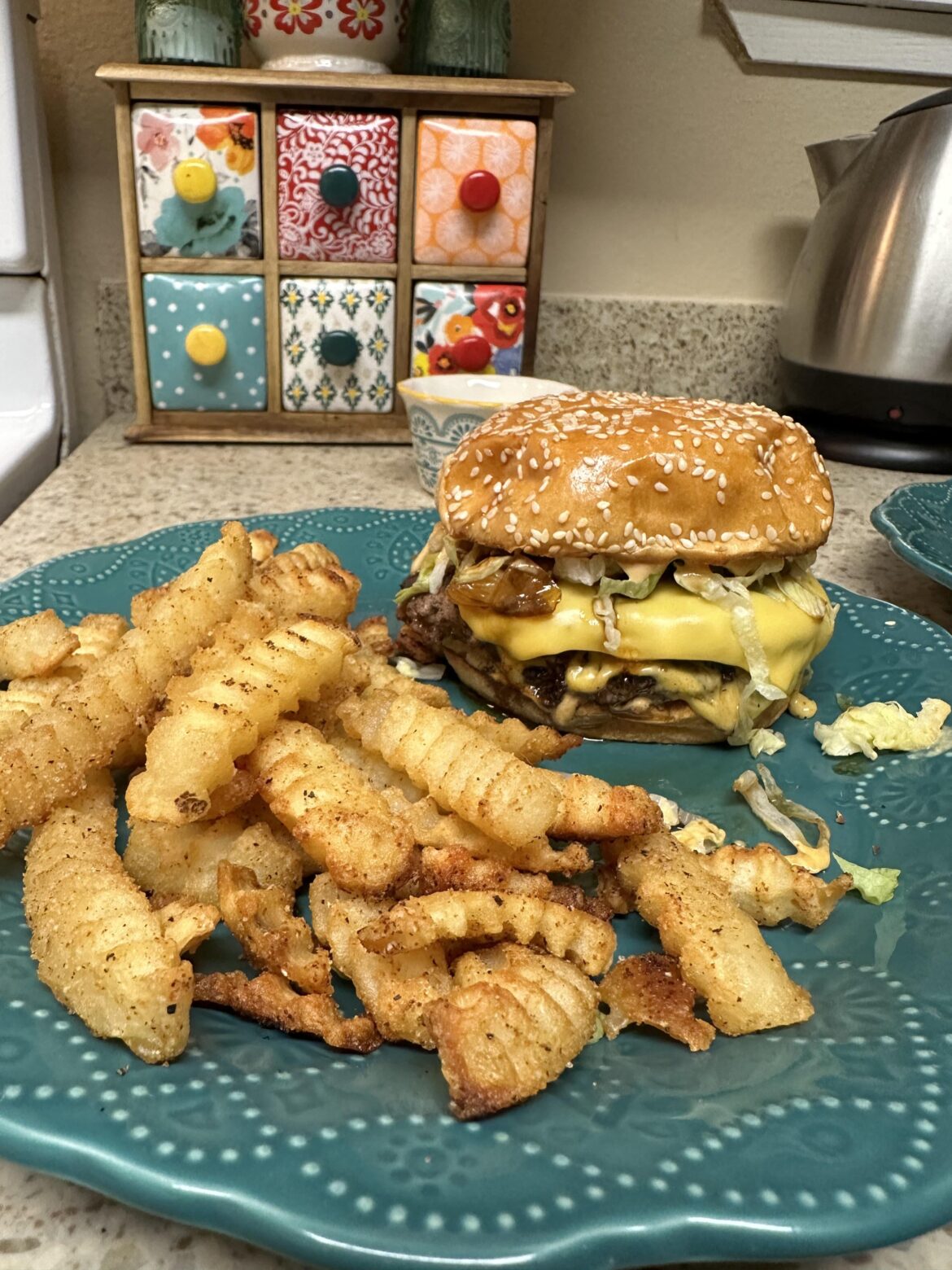 Same double cheese smashburger w/lettuce, sauce and seasoned crinkle cut fries but now with caramelized onions.
