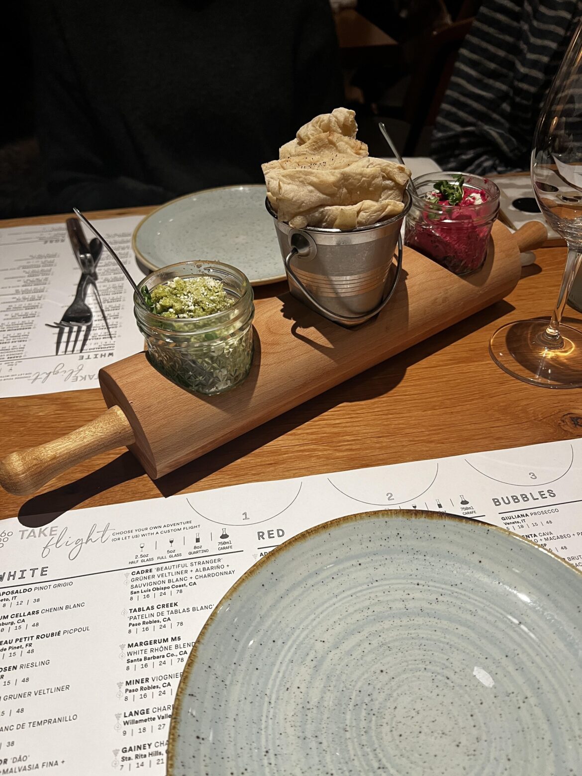 Pita and dip on a rolling pin