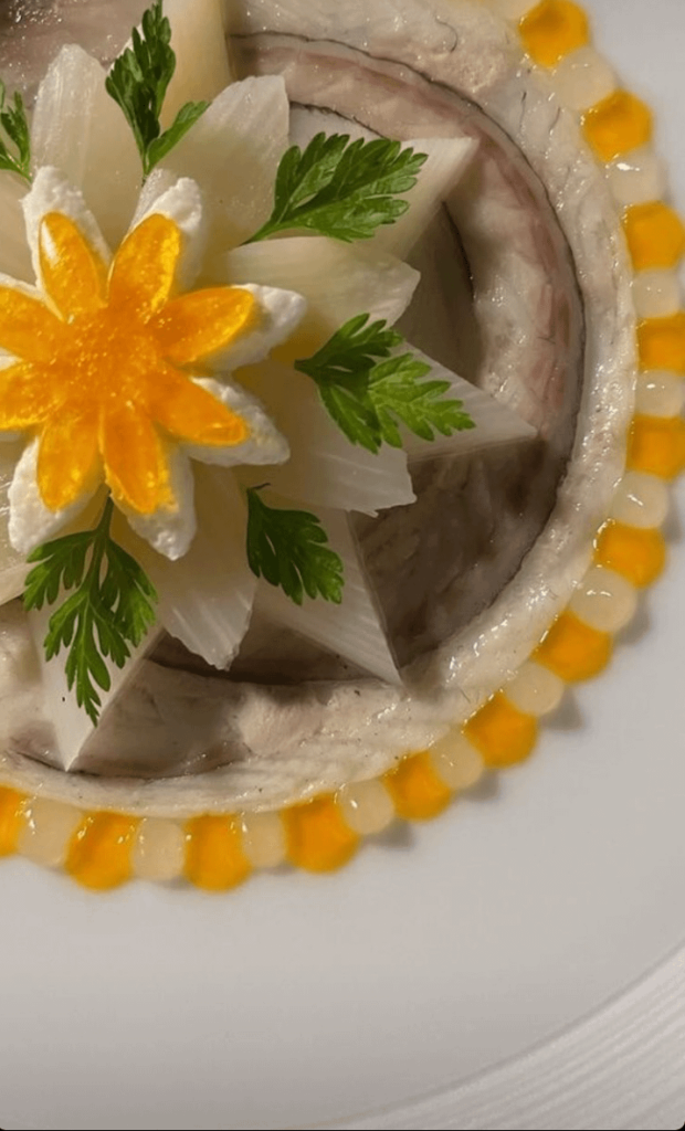 Smoked eel, asparagus, cucumberchip, passion fruitgelee and gel, cucumbergel, chervil. Served with a Basil-Caviarsauce.