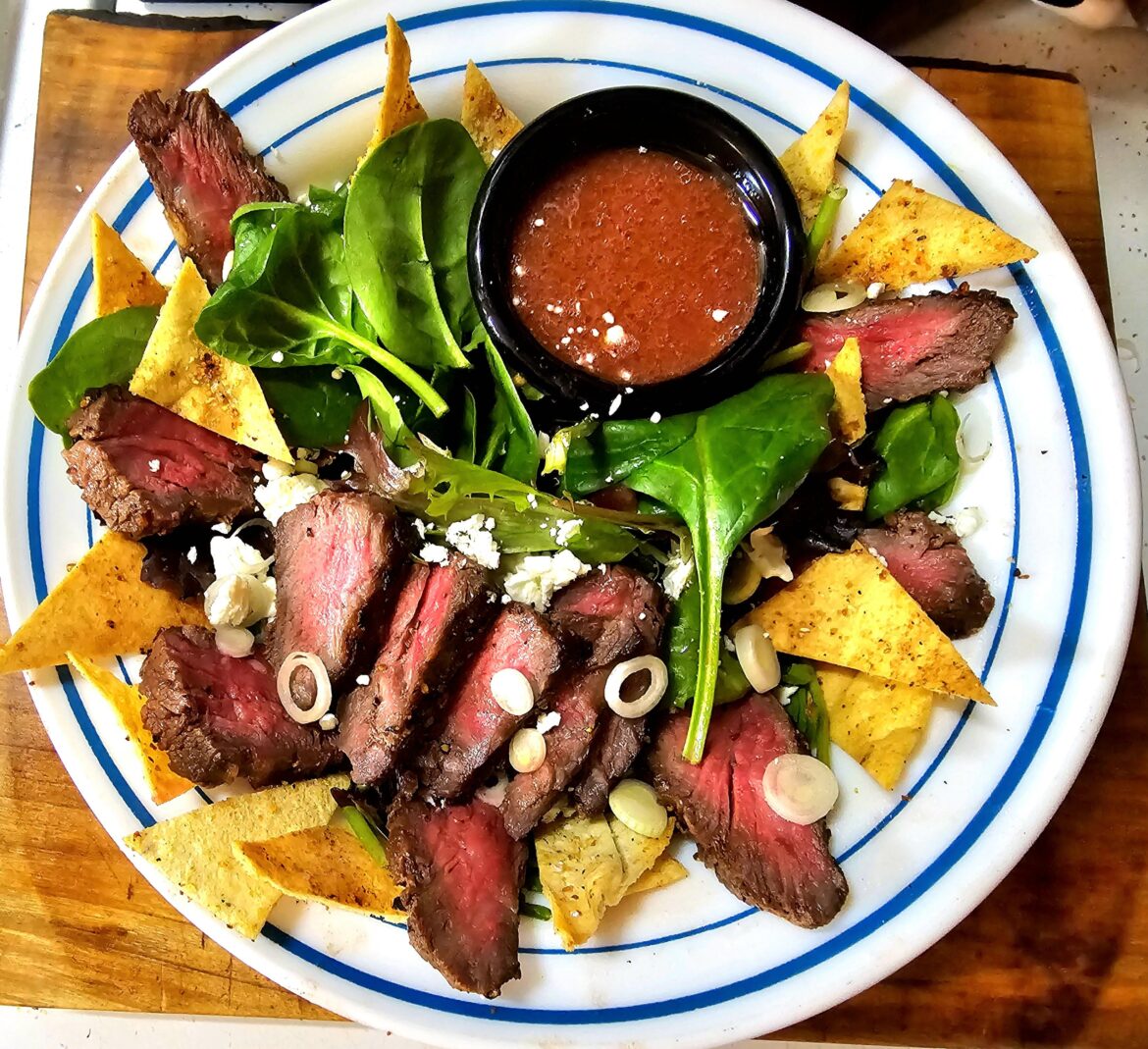 Spinach/Mixed Greens Salad w/ Steak, Feta, Garlic Pita Chips, and a Pomegranate Vinaigrette