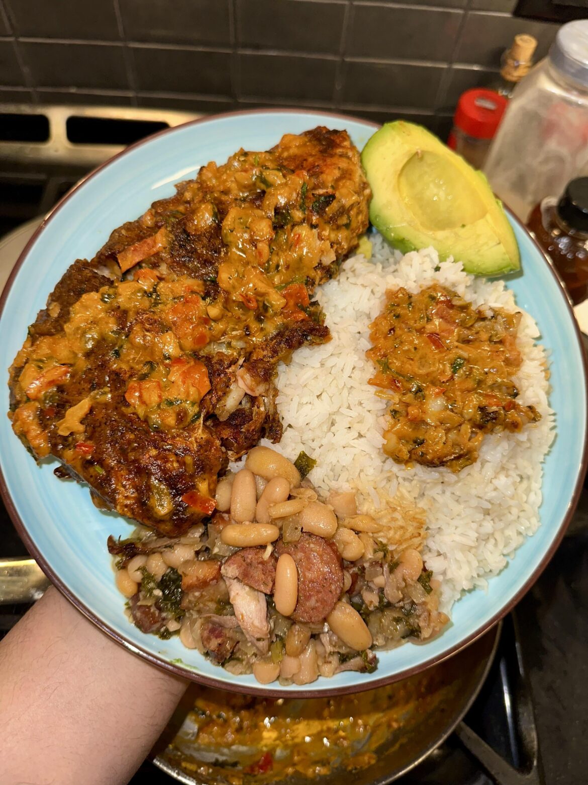 Fried red snapper, rice, beans and avocado.