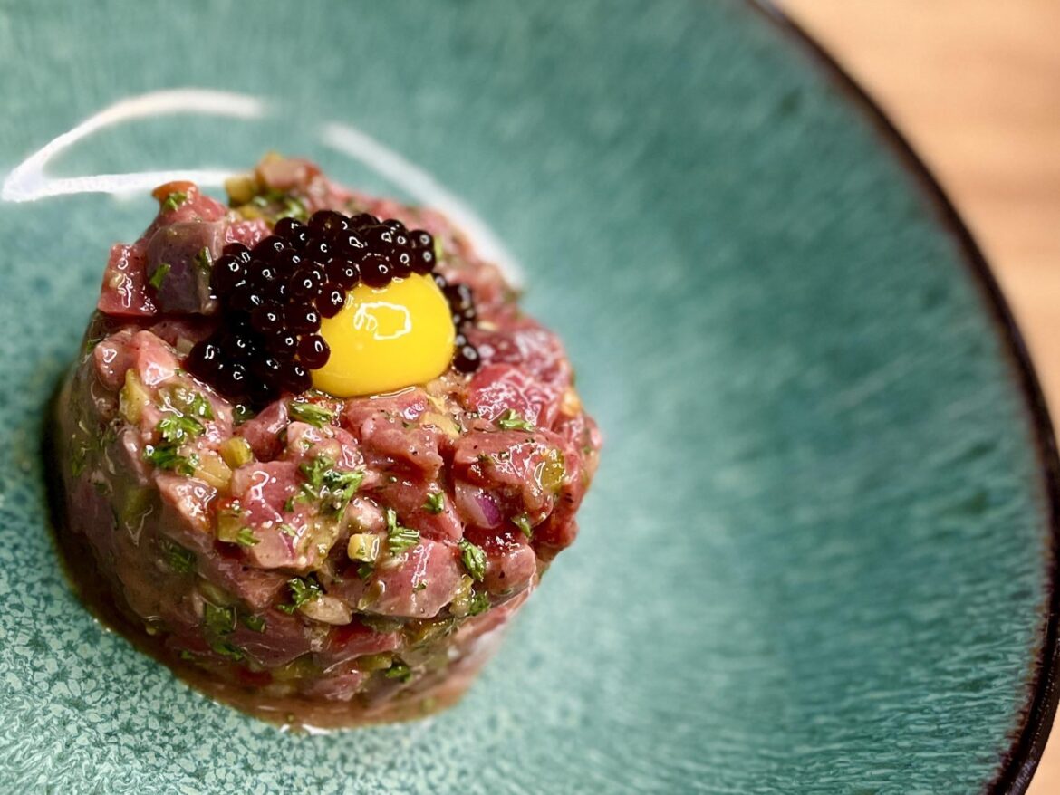 Steak tartare, quail egg yolk, Worcestershire sauce “caviar”
